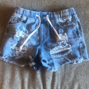 Light colored blue Jean shirts with rips. Size x small. Draw string . YMI brand